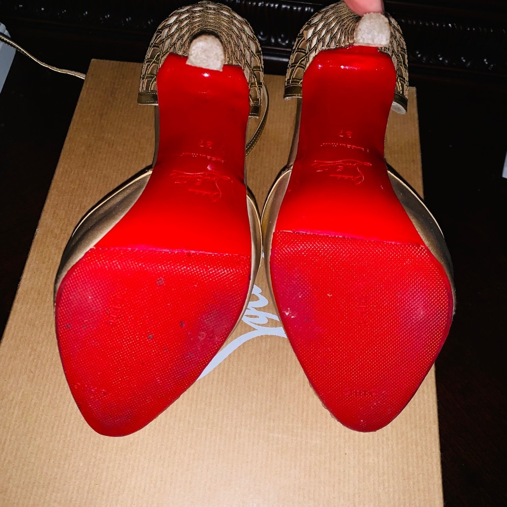 Size 7 Christian louboutins, gold.Gently used,red protector. Authentic 100%